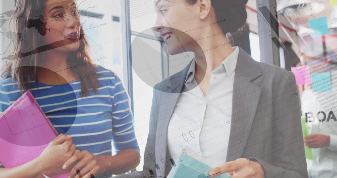 Businesswomen Discussing with Data and Analytics Overlay