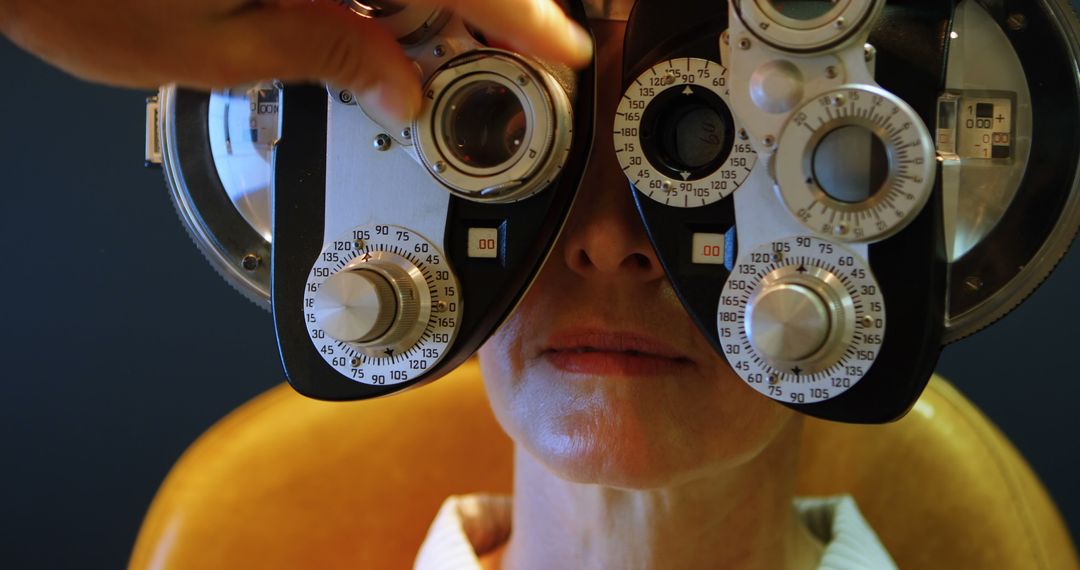 Woman undergoing eye exam with phoropter - Free Images, Stock Photos and Pictures on Pikwizard.com