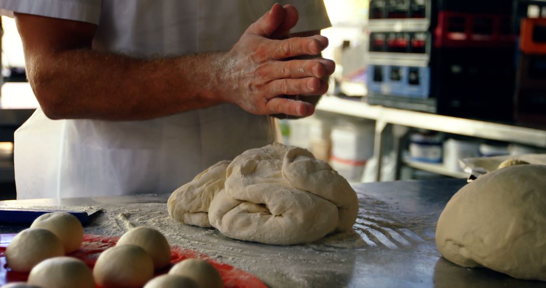 Baker Kneading Dough with Hands in Kitchen - Free Images, Stock Photos and Pictures on Pikwizard.com