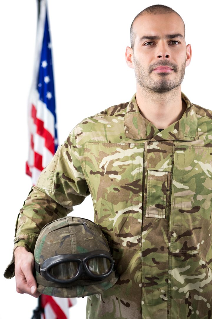 Portrait of smiling soldier standing with combat helmet - Free Images, Stock Photos and Pictures on Pikwizard.com