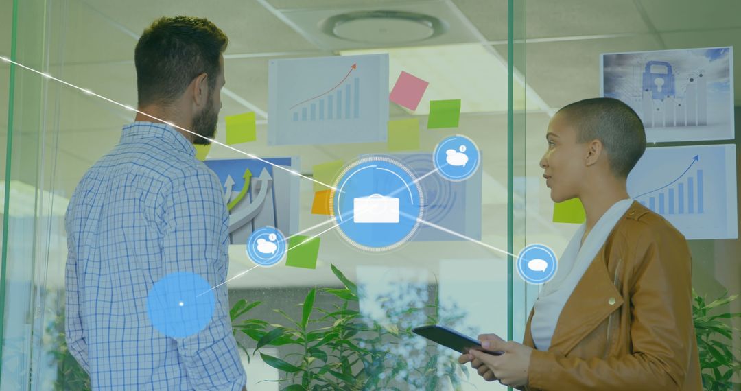 Coworkers Engaged in Strategic Planning with Digital Display