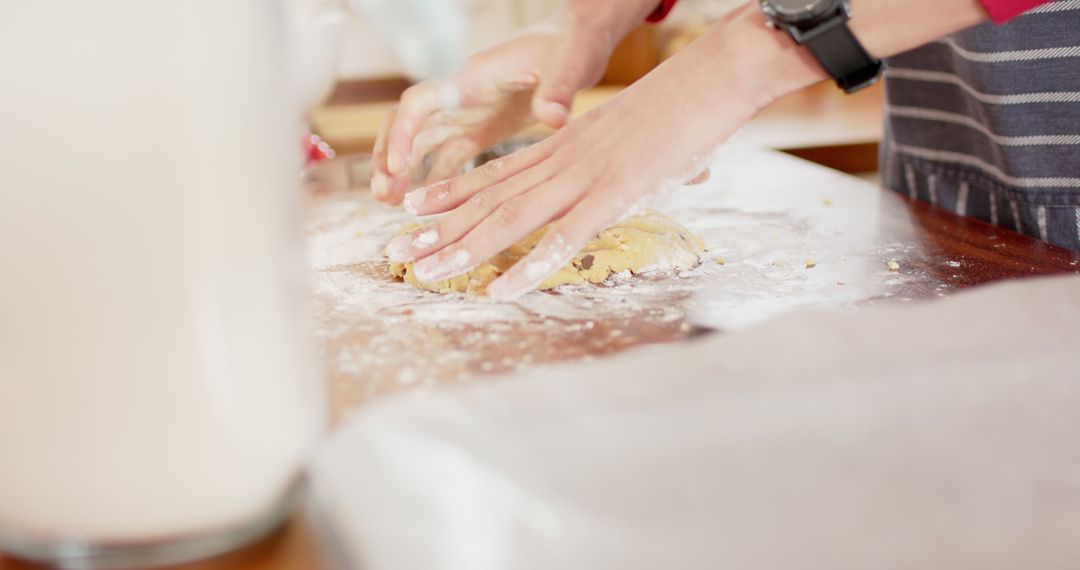 Person rolling out dough on kitchen countertop with flour - Free Images, Stock Photos and Pictures on Pikwizard.com