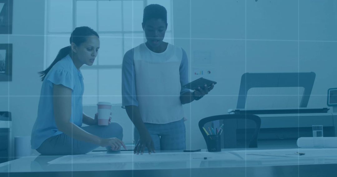 Creative Designers Discussing Project Plans in Modern Office