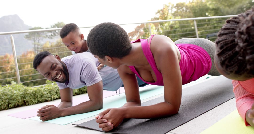 Happy African American Family Doing Outdoor Yoga Together - Free Images, Stock Photos and Pictures on Pikwizard.com