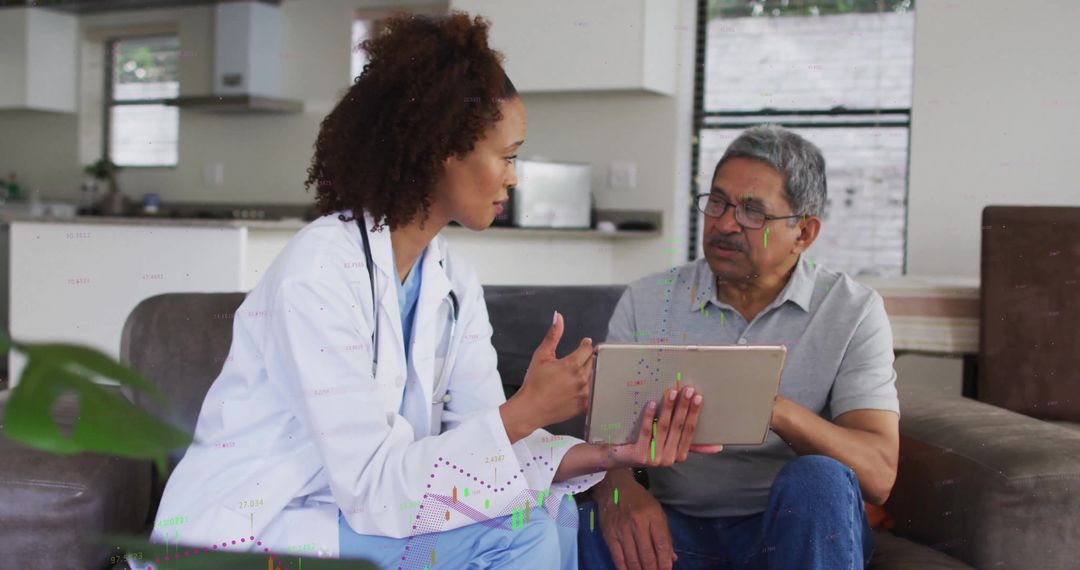 Doctor Advises Senior Patient in Home Using Digital Tablet Communication