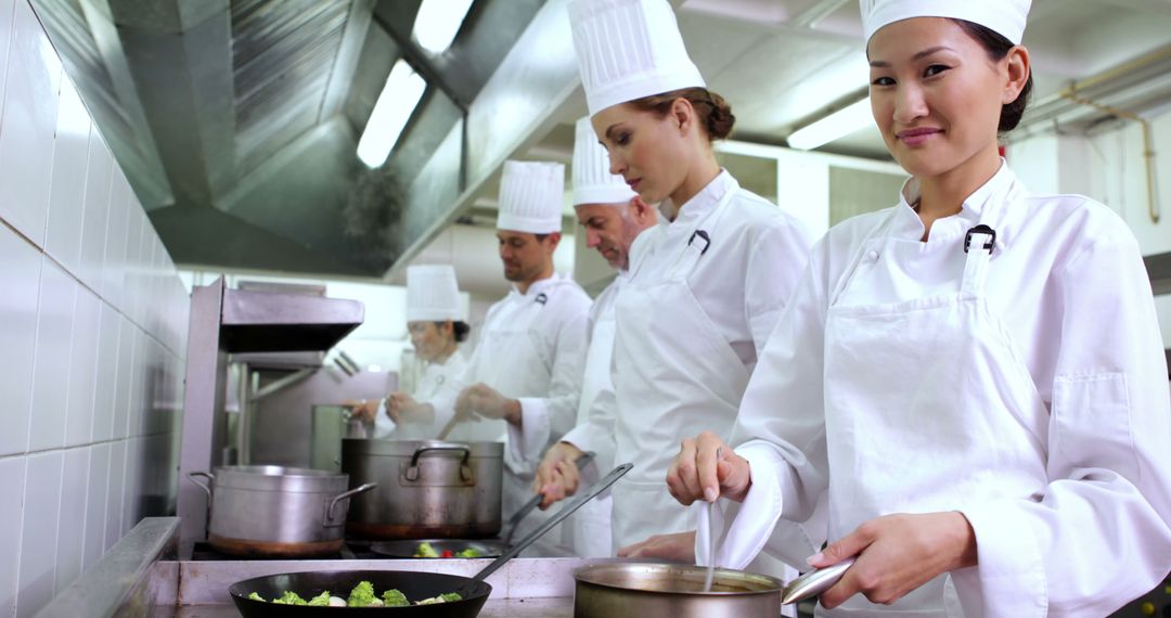 Professional Chefs Preparing Meals in Commercial Kitchen - Free Images, Stock Photos and Pictures on Pikwizard.com