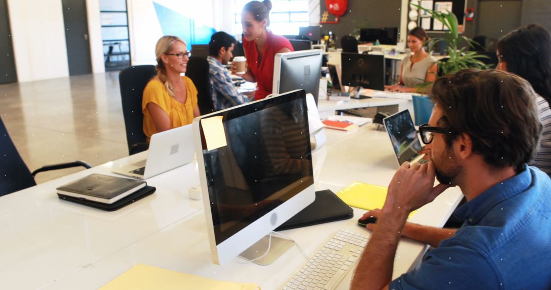 Collaborative Team in Modern Office Environment