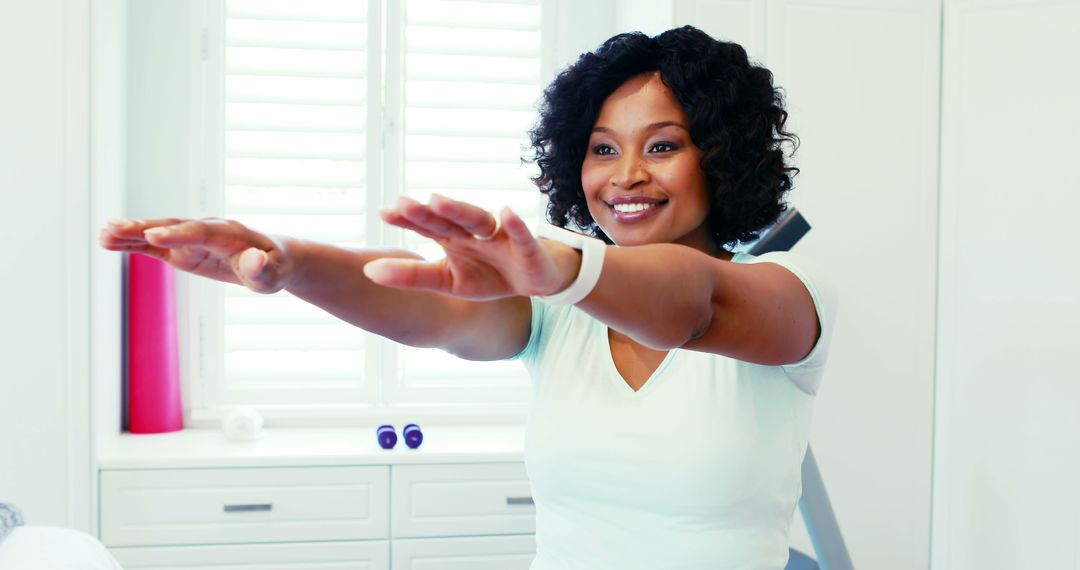 Smiling African American Woman Exercising at Home - Free Images, Stock Photos and Pictures on Pikwizard.com