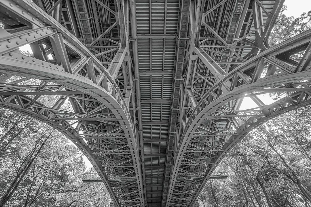Detailed View of an Iron Bridge Underside in Black and White - Free Images, Stock Photos and Pictures on Pikwizard.com