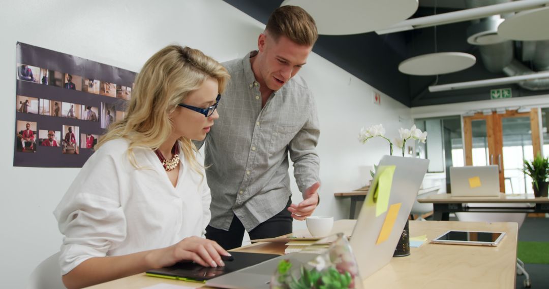 Caucasian Business Colleagues Collaborate in Modern Office Environment