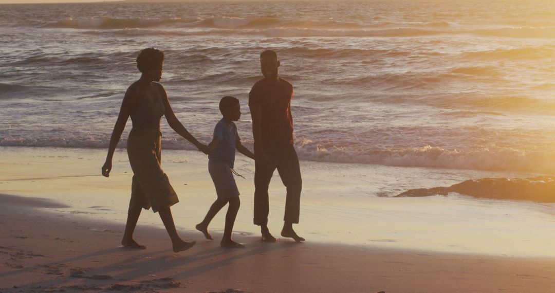 Family Enjoying Sunset Walk on Beach Shore - Free Images, Stock Photos and Pictures on Pikwizard.com