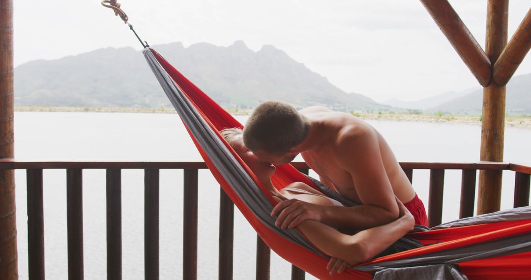 Couple Relaxing in Hammock by Serene Lake - Free Images, Stock Photos and Pictures on Pikwizard.com