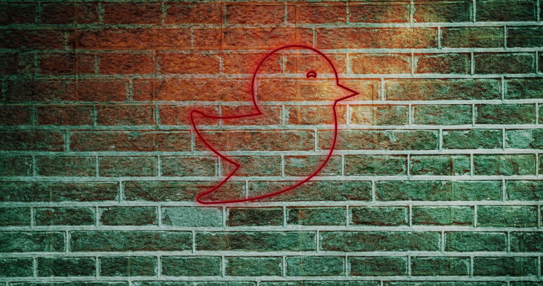 Red Digital Bird Icon on Brick Wall Representing Social Media - Free Images, Stock Photos and Pictures on Pikwizard.com