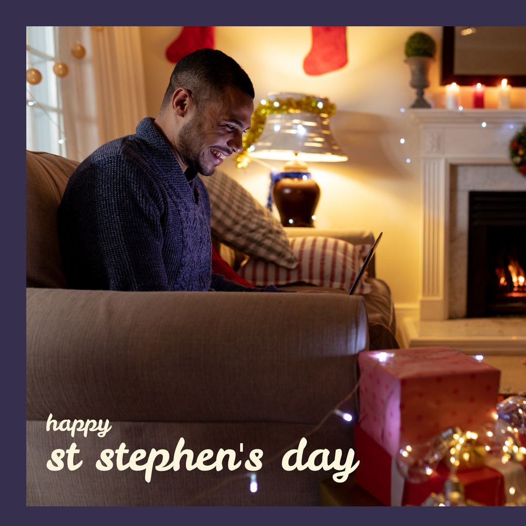 Man Enjoying St. Stephen's Day by Cozy Fireplace with Laptop - Download Free Stock Templates Pikwizard.com