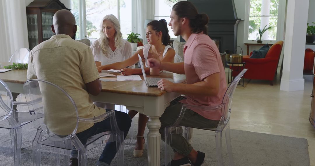 Diverse Team Collaborating on Wedding Plans with Technology