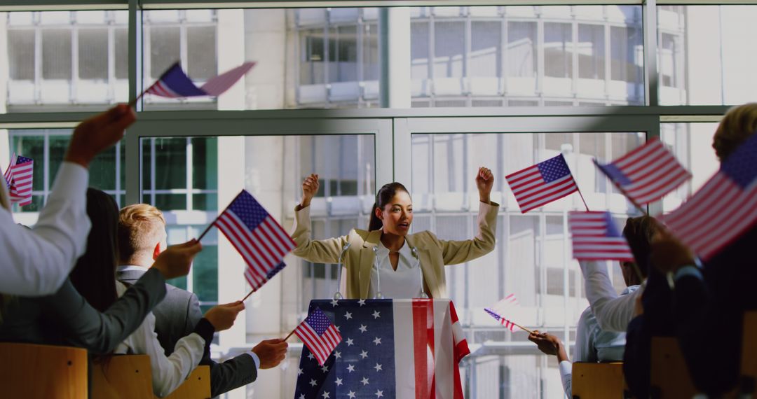 Confident Woman Politician Celebrating with Supporters Waving American Flags - Free Images, Stock Photos and Pictures on Pikwizard.com