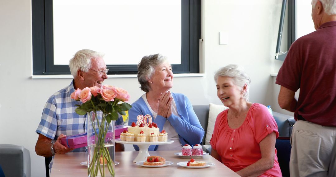 Senior Woman Receiving Surprise Gift at Birthday Celebration - Free Images, Stock Photos and Pictures on Pikwizard.com