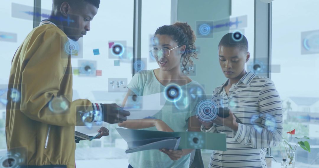 Collaborating team reviewing documents with augmented reality overlays in modern office