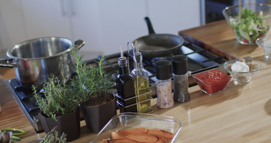 Modern Kitchen Counter with Herbs and Cookware Setup - Free Images, Stock Photos and Pictures on Pikwizard.com