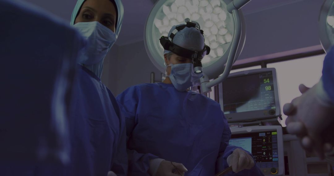 Female Surgeons Performing Operation in Sterile Operating Room