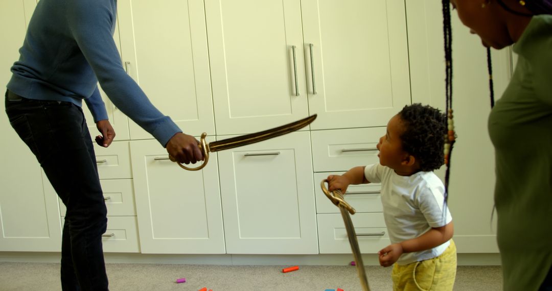 Family Bonding Activity Using Toy Swords in Modern Home - Free Images, Stock Photos and Pictures on Pikwizard.com