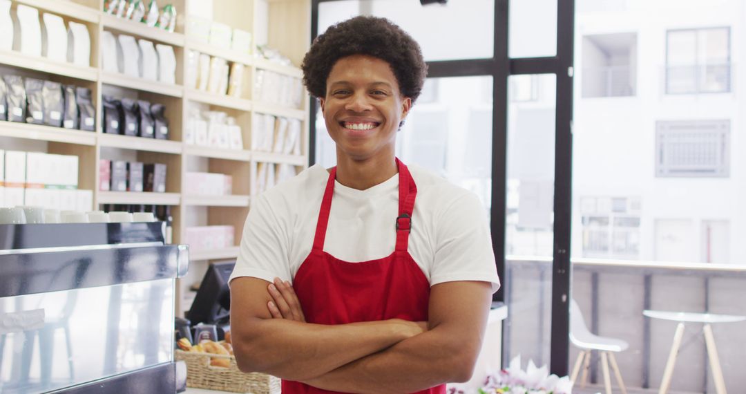 Image of happy biracial waiter standing in coffee shop - Free Images, Stock Photos and Pictures on Pikwizard.com