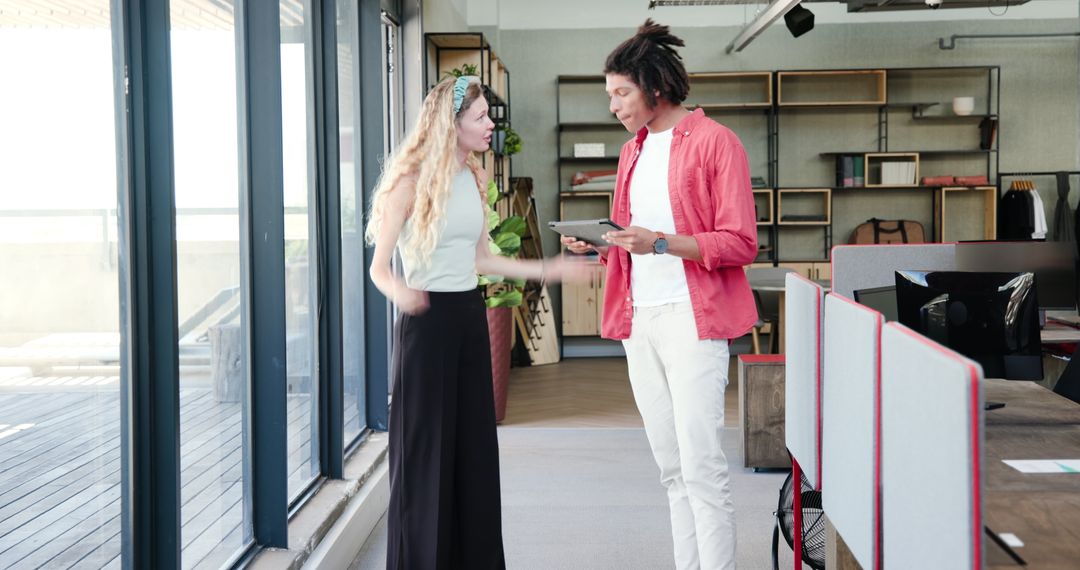 Colleagues Sharing Friendly Interaction in Modern Workspace