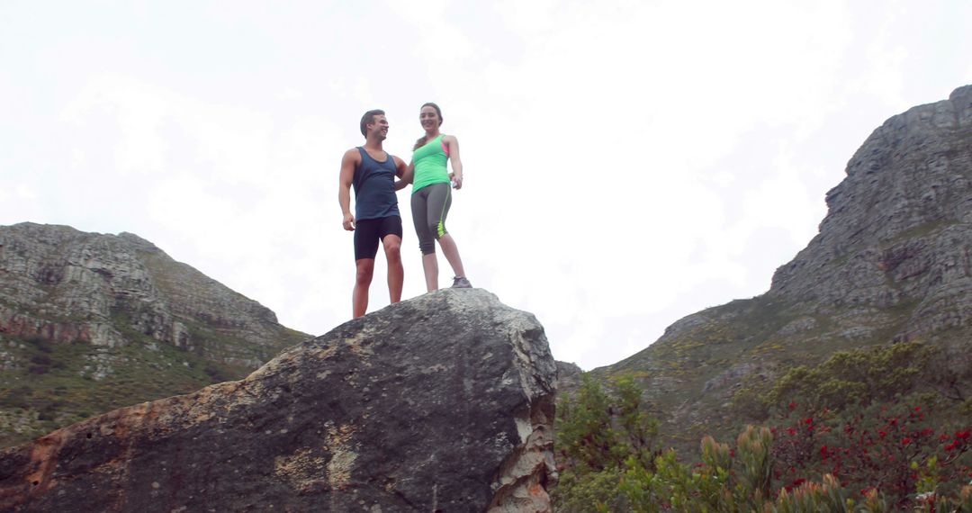 Couple Enjoying Peak Mountain Hike Against Scenic Backdrop - Free Images, Stock Photos and Pictures on Pikwizard.com