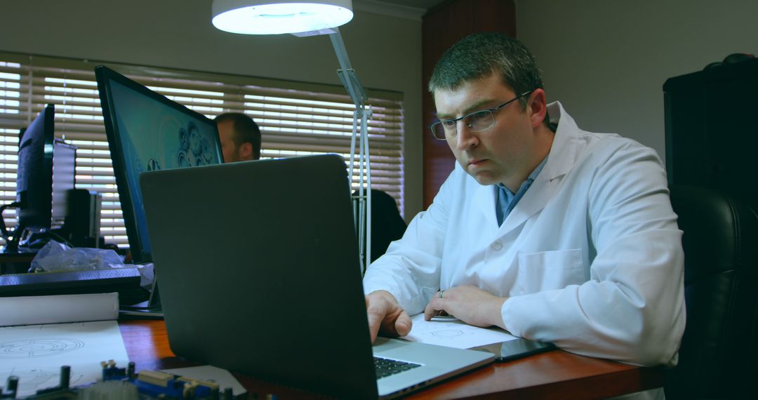 Focused Scientist Working on Laptop in Research Laboratory - Free Images, Stock Photos and Pictures on Pikwizard.com