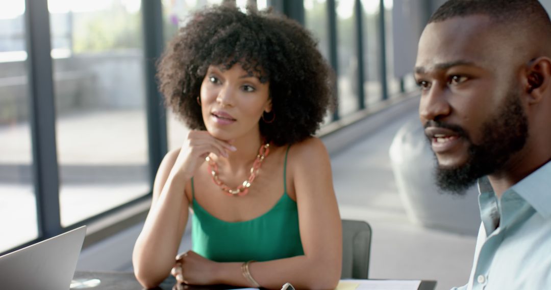 Colleagues in Collaborative Office Meeting Discussing Strategy