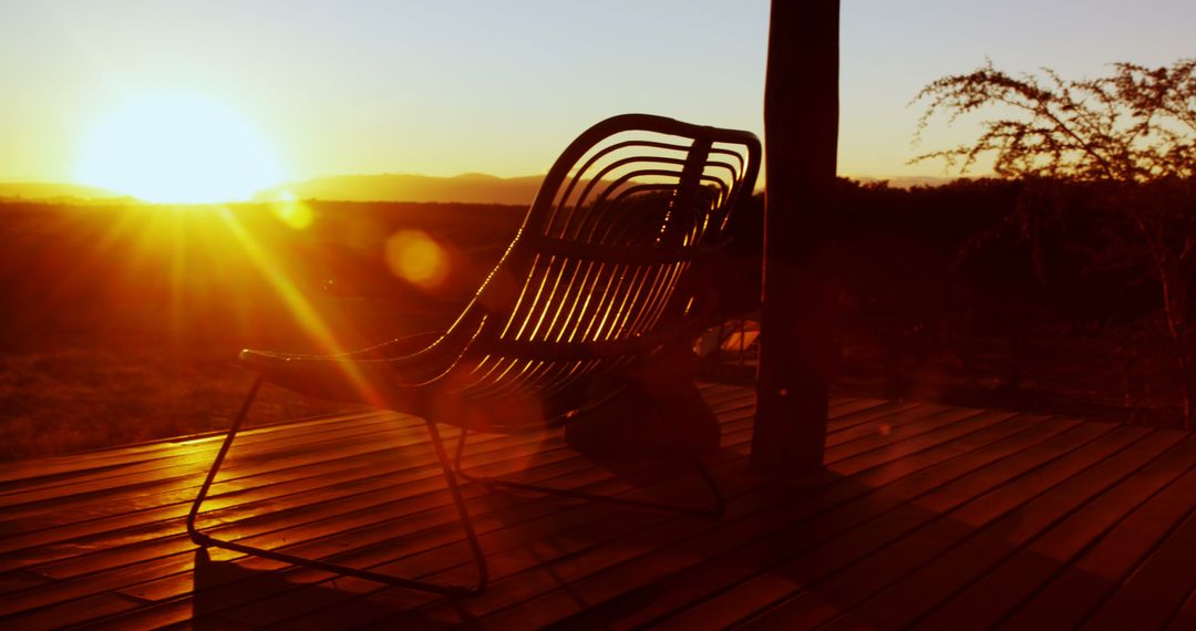 Sunset View from Wooden Patio with Comfortable Chair - Free Images, Stock Photos and Pictures on Pikwizard.com