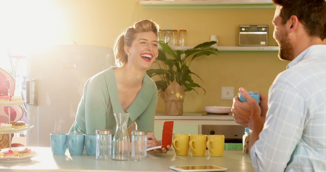 Couple Enjoying Coffee and Laughter in Bright Kitchen - Free Images, Stock Photos and Pictures on Pikwizard.com