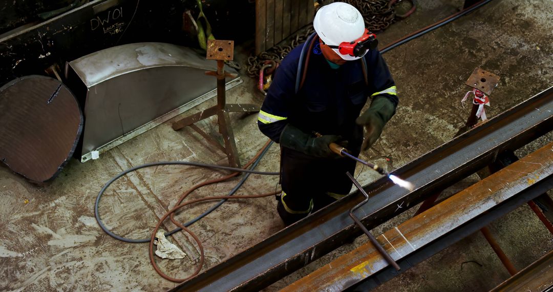 Industrial Worker Welding Metal with Precision in Factory - Free Images, Stock Photos and Pictures on Pikwizard.com