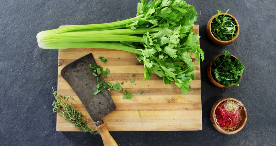 Freshly Chopped Celery on Wooden Cutting Board in Rustic Kitchen Scene - Free Images, Stock Photos and Pictures on Pikwizard.com