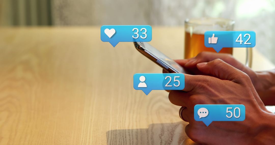 Hand Holding Smartphone with Social Media Notifications