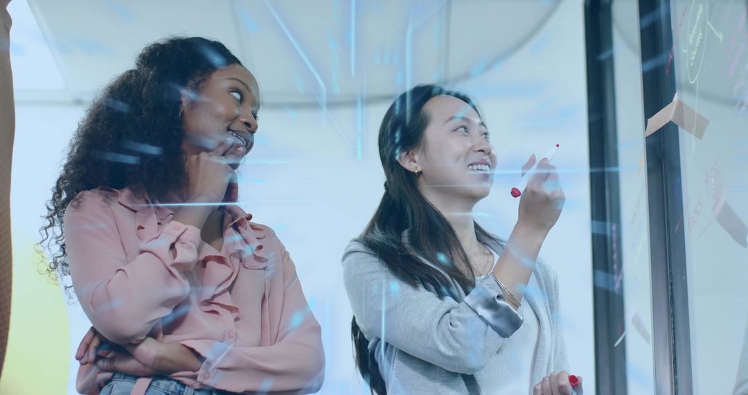 Diverse Team Innovating with Digital Technology in Modern Office