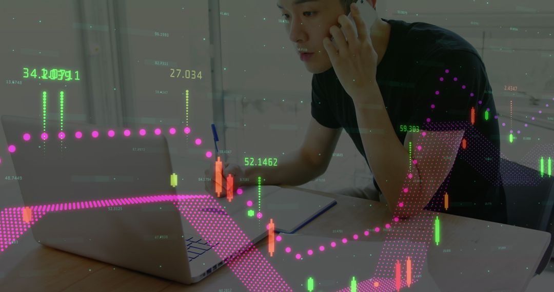 Businessman Analyzing Financial Data with Smartphone and Laptop