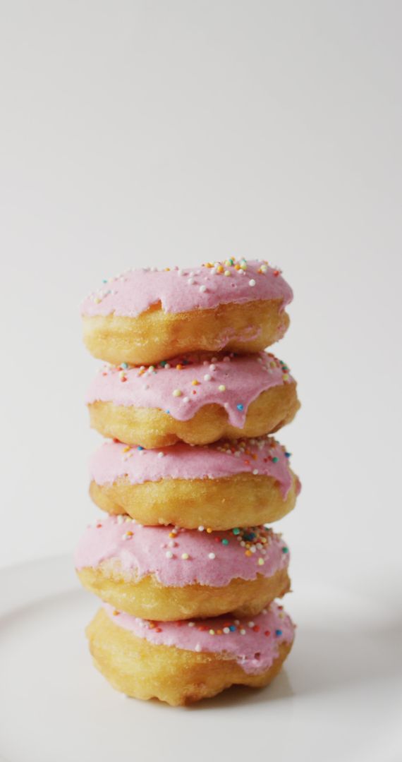 Stack of Donuts with Pink Frosting and Sprinkles - Free Images, Stock Photos and Pictures on Pikwizard.com