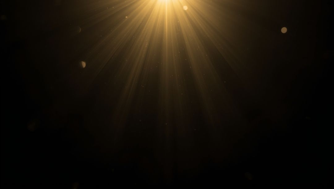Radiant Golden Light Beams in Dark Atmosphere