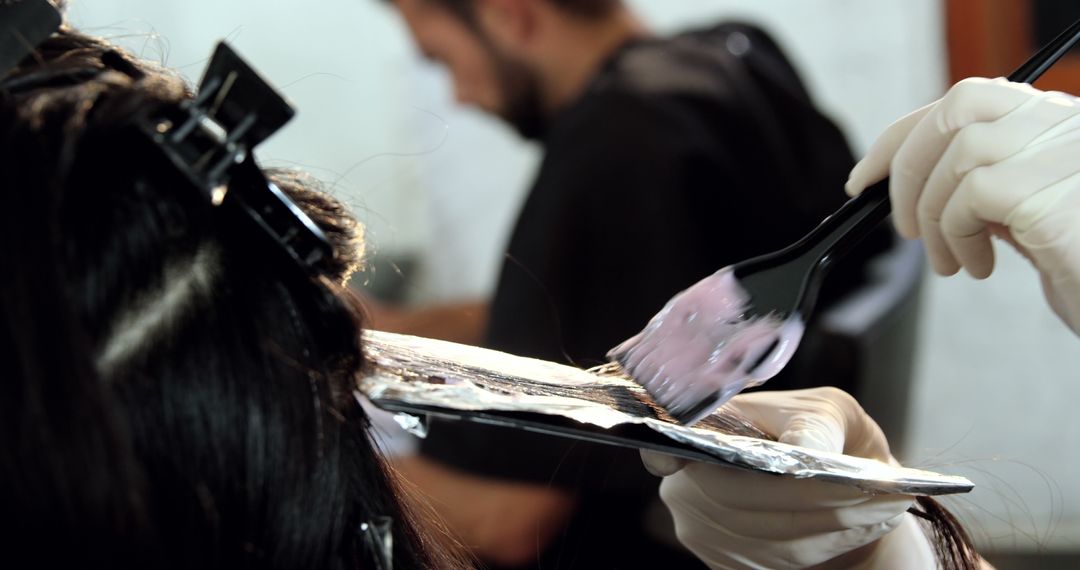 Woman Receiving Hair Coloring Treatment at Salon - Free Images, Stock Photos and Pictures on Pikwizard.com