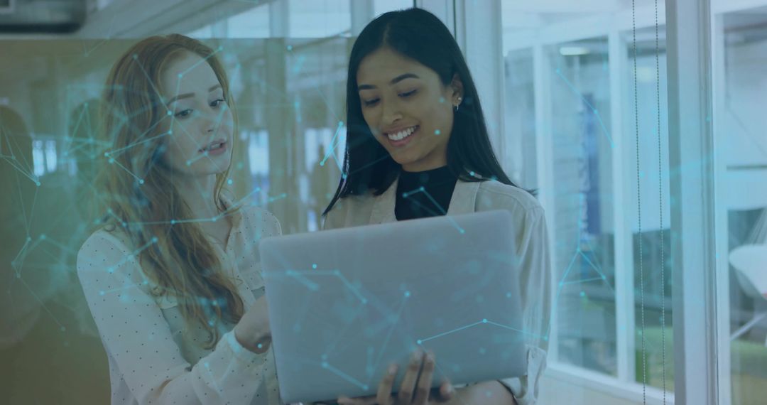 Tech Professionals Collaborating on Laptop with Digital Network Overlay