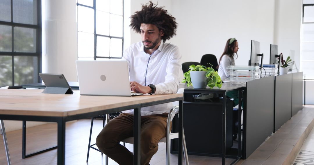 Focused Professionals Collaborating in Modern Office Workspace