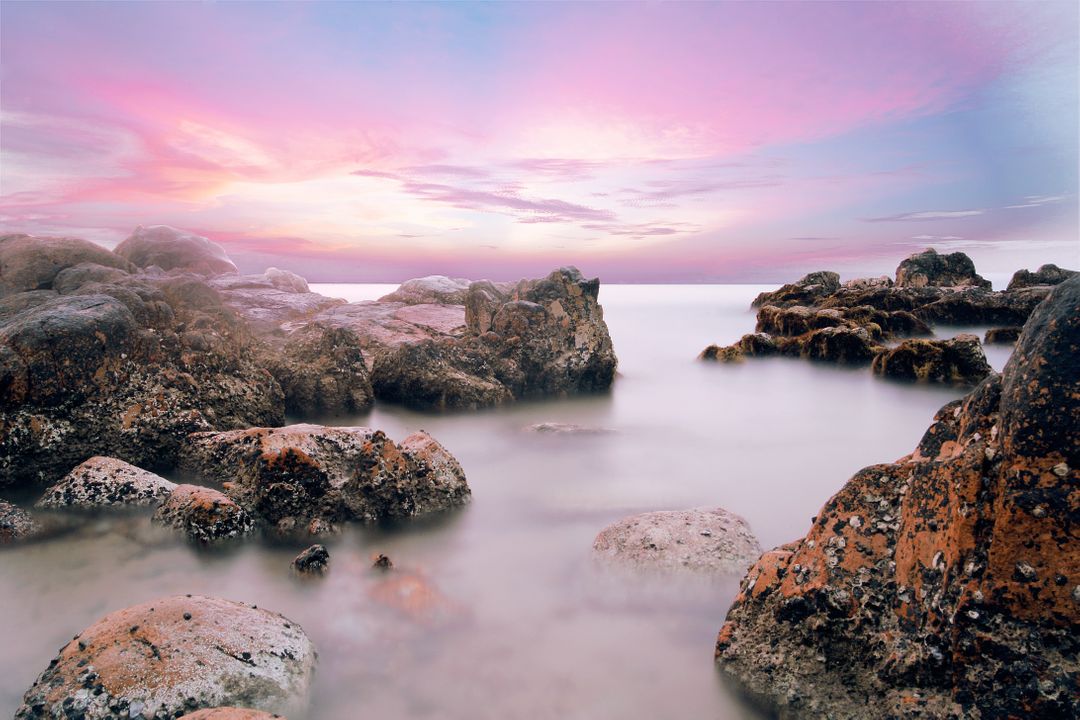 Dreamy Seascape with Rocky Shoreline at Sunset - Free Images, Stock Photos and Pictures on Pikwizard.com