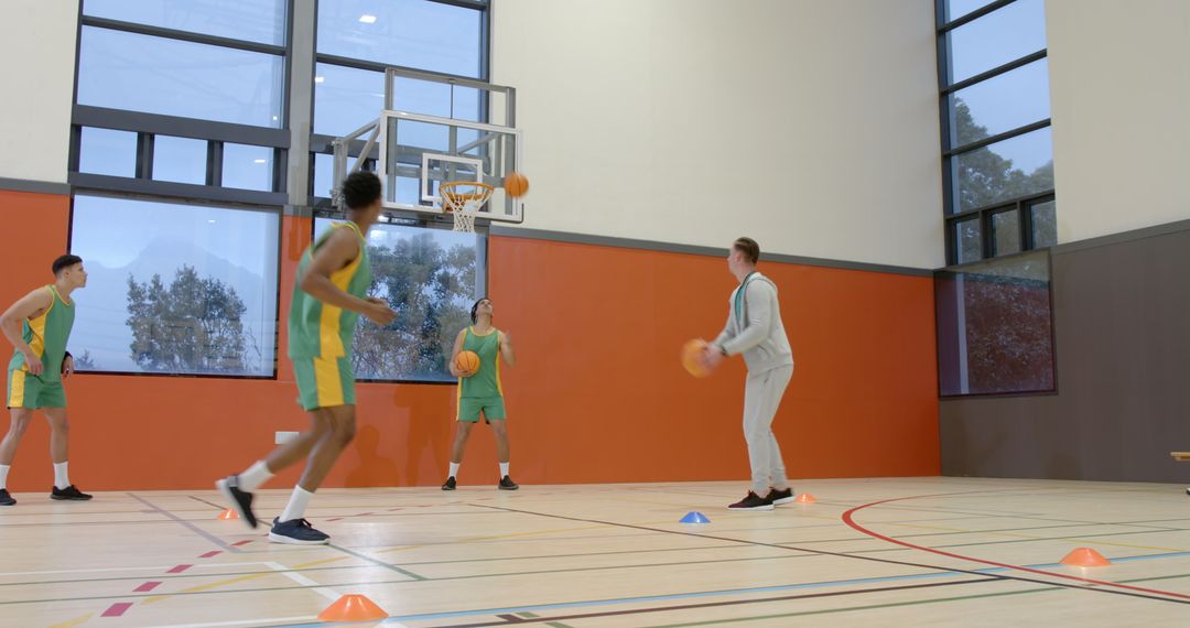 Basketball Team Practicing Passing Drills in Indoor Court