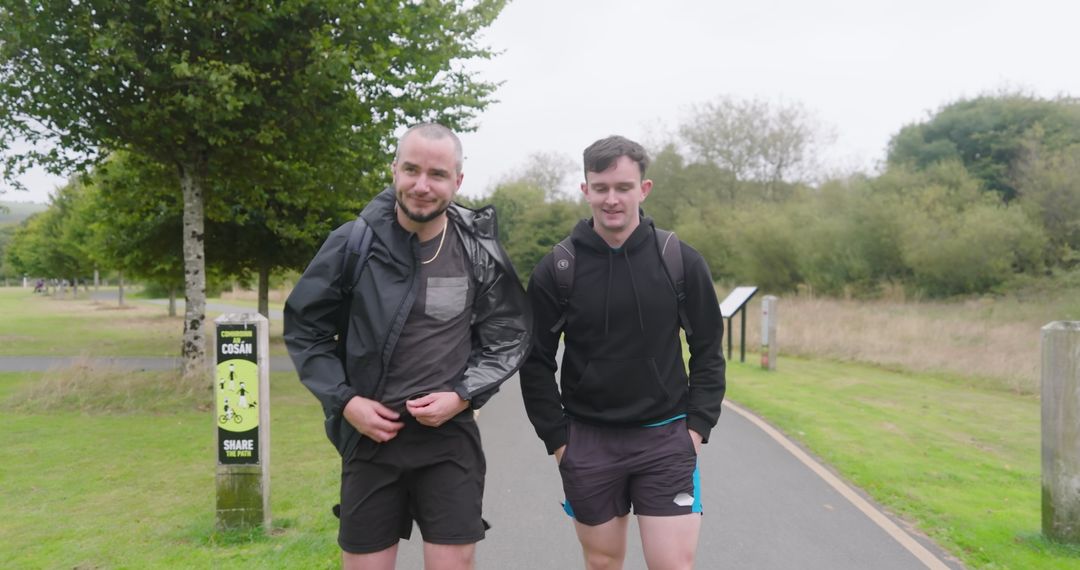 Friends Walking in Park for Exercise and Adventure