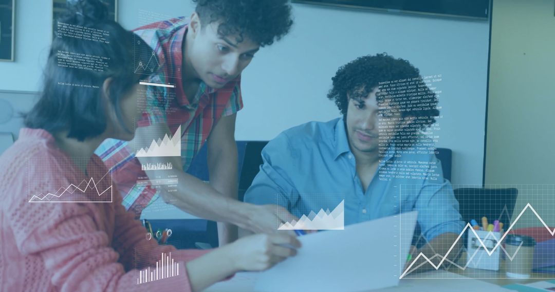 Young Professionals Collaborating with Data Visualizations in Office