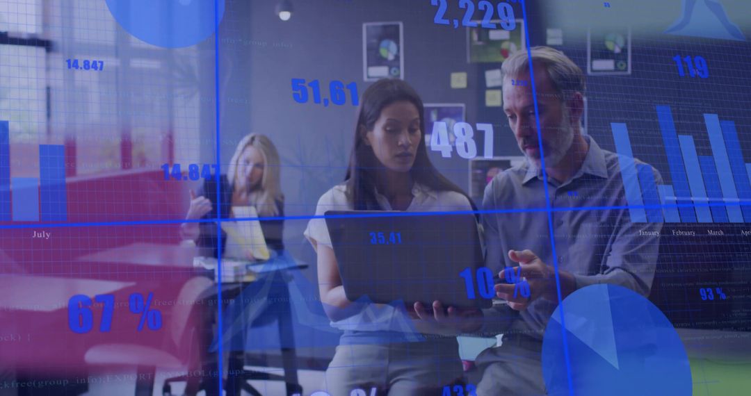 Business team analyzing digital data dashboard on laptop with blue charts overlay