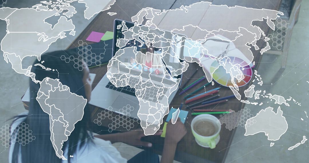 Designer Working in Modern Home Office with Digital Global Map Overlay