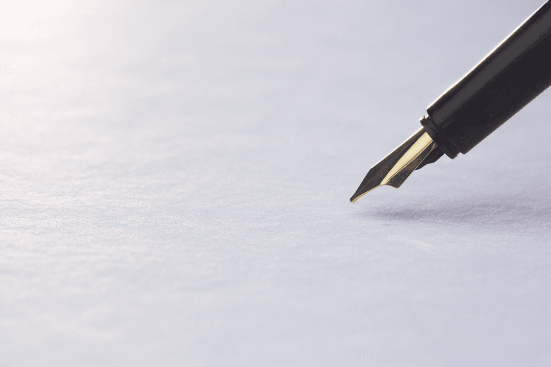 Elegant Fountain Pen Tip Writing on Transparent White Paper