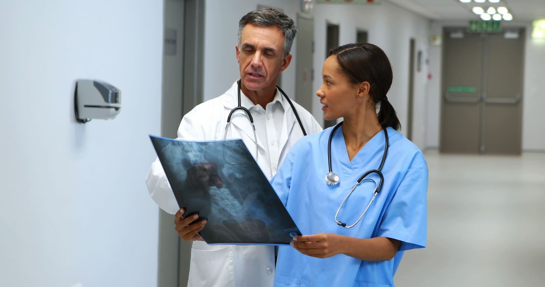 Medical Team Analyzing X-Ray in Hospital - Free Images, Stock Photos and Pictures on Pikwizard.com